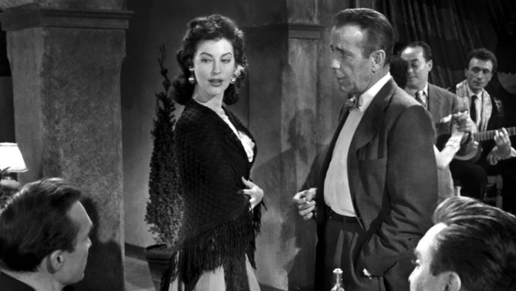 María Vargas (Ava Gardner) i Harry Dawes (Humphrey Bogart) a la taverna de Madrid on balla la comtessa descalça